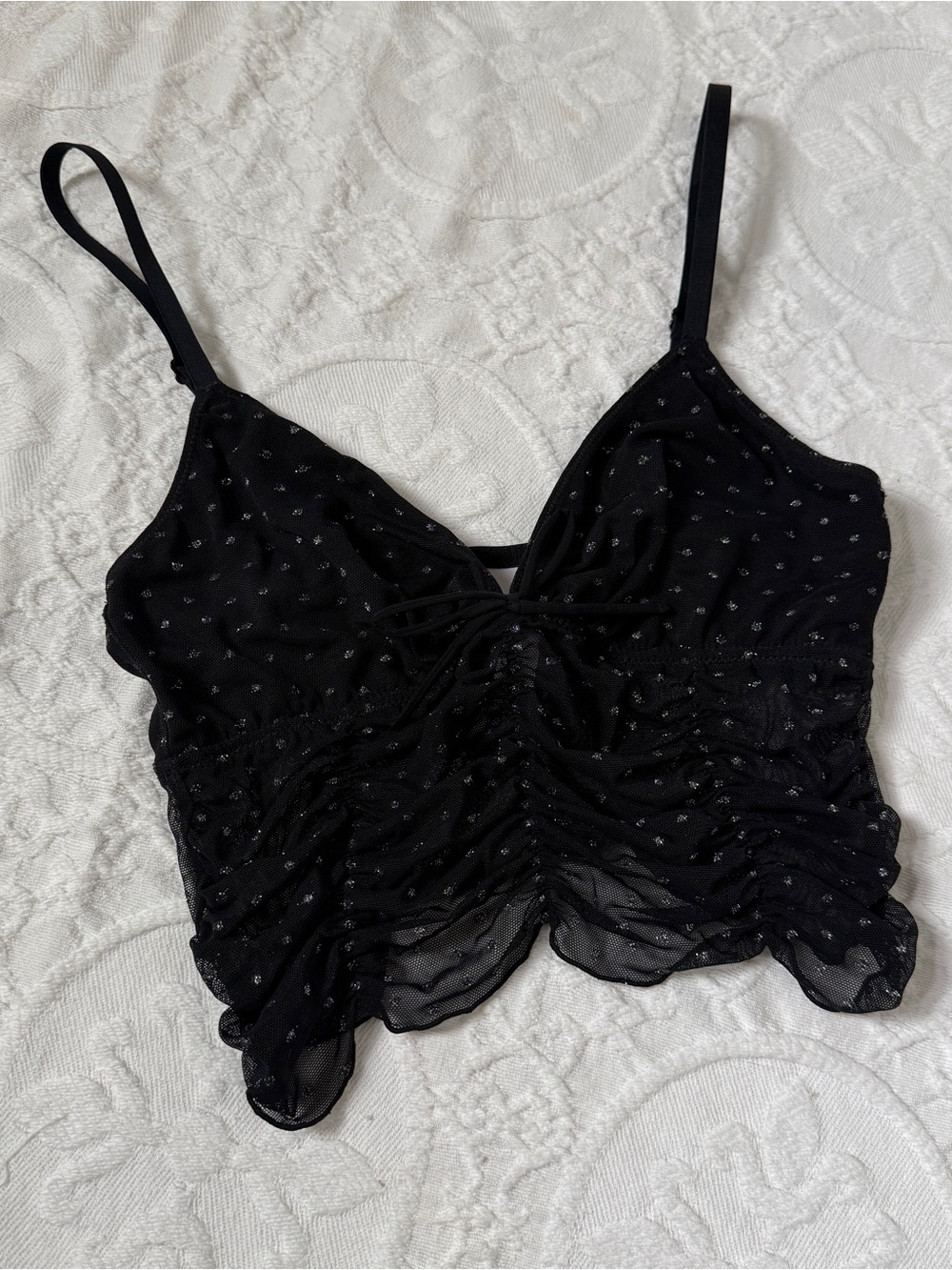 black sheer crop top with silver glitter polkadots and a bow